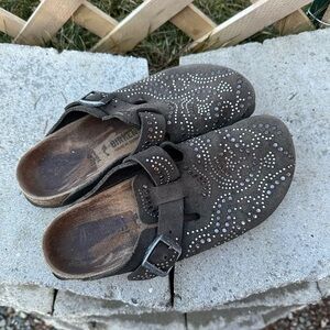 Well-worn studded Birkenstock suede clogs